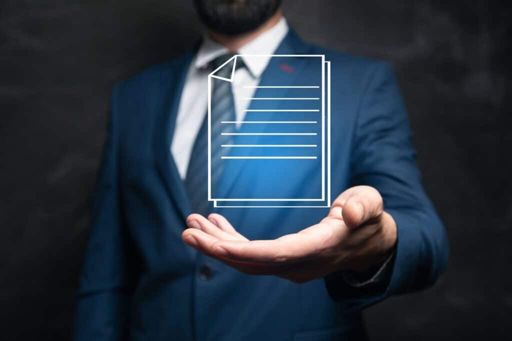 icona di documento a rappresentare una policy aziendale poggiata sulla mano di un professionista
